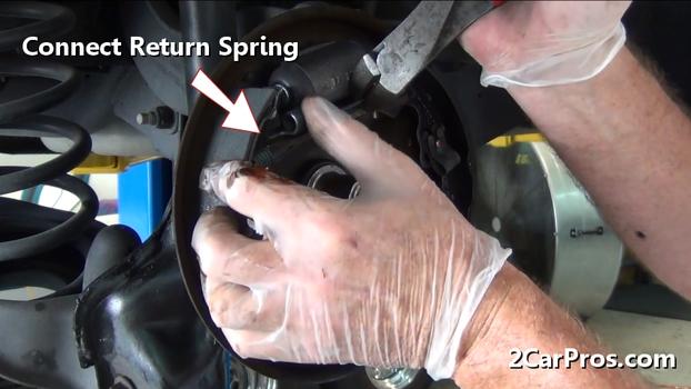 attach brake shoe return spring