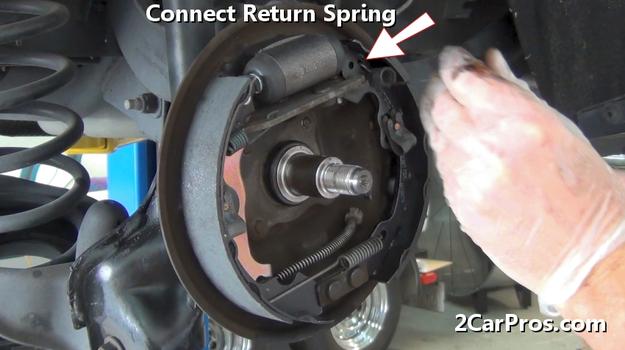 connect brake shoe return spring