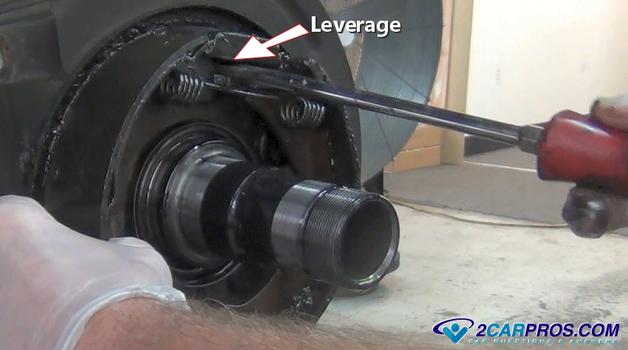 leverage the parking brake shoes