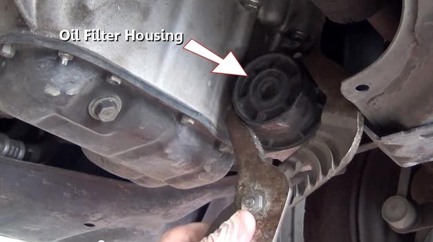 loosen oil filter housing