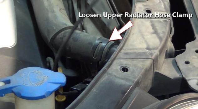 loosen upper radiator hose clamp