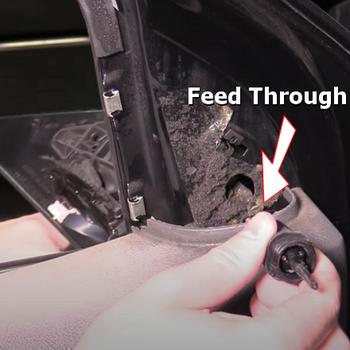 mirror control cable feed through