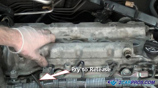 pry release valve cover