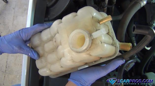 remove automotive engine coolant reservoir