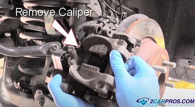 remove rear brake caliper