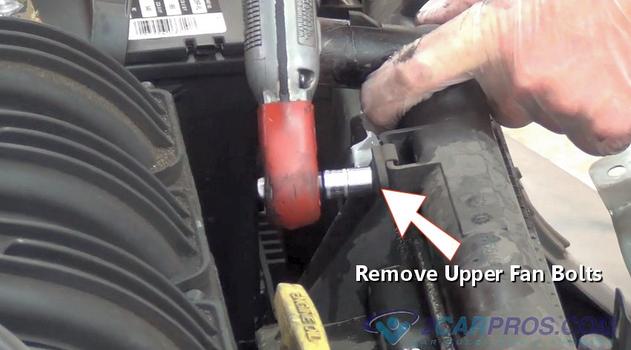 remove upper cooling fan bolts