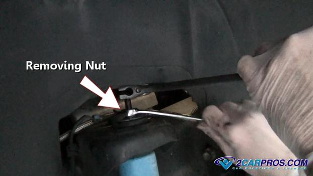 removing upper shock nut