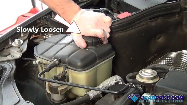 slowly loosen radiator cap