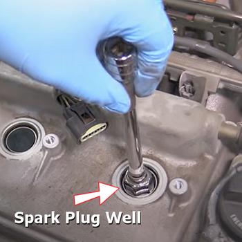 spark plug well
