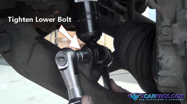 tighten lower shock bolt