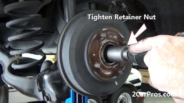 tighten brake drum retainer nut